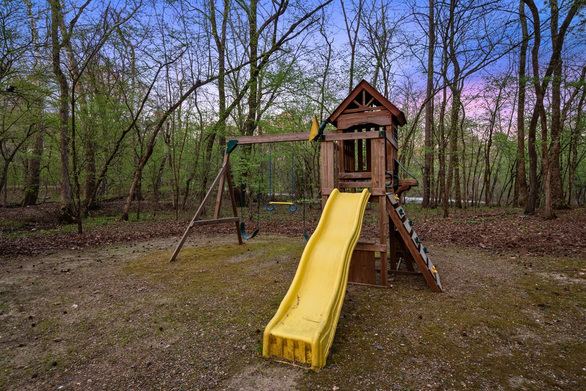 A playset gives younger guests their own space to climb, slide, and stay entertained outdoors.