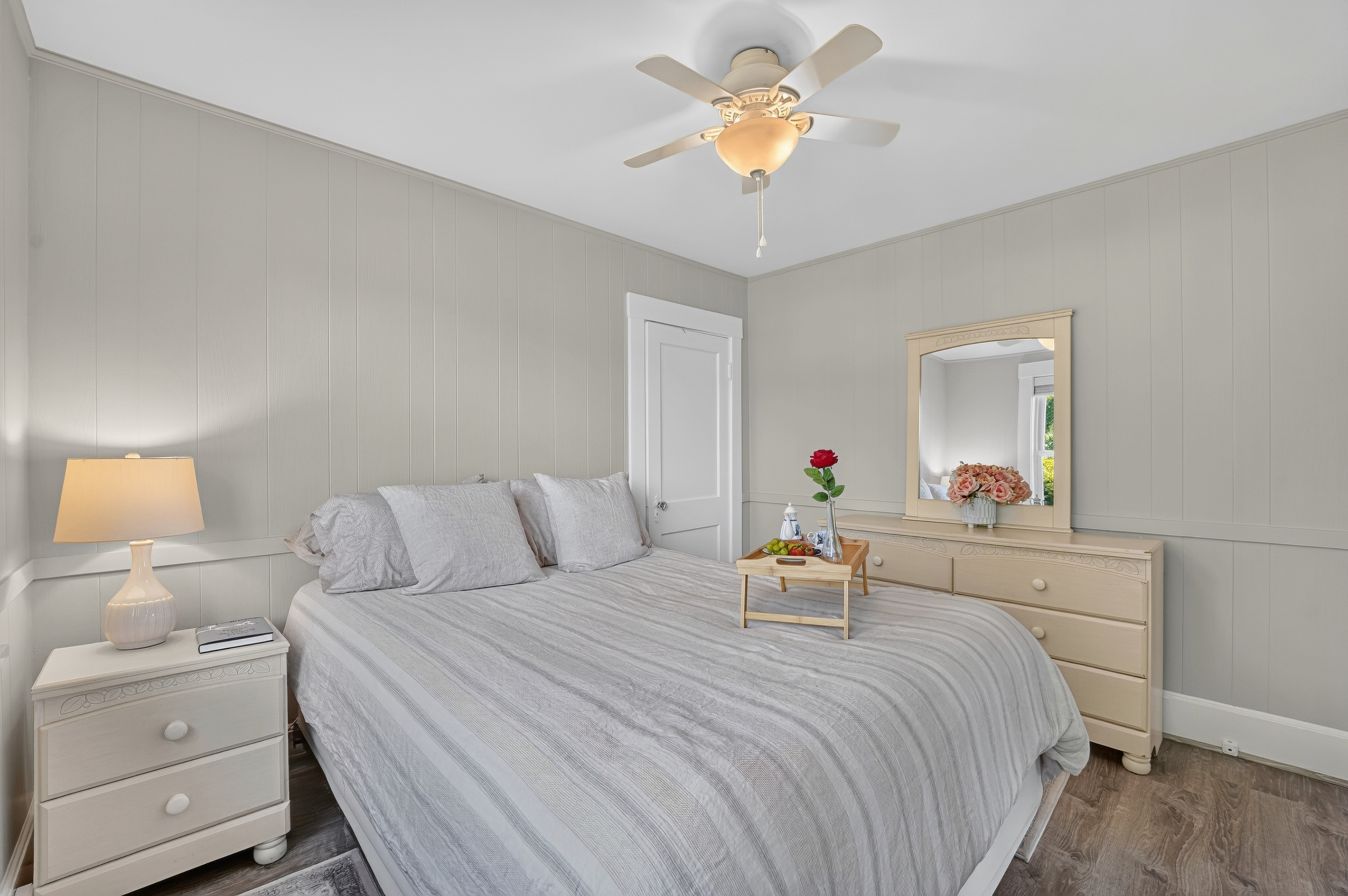 Inviting guest bedroom with soft linens, stylish décor, and a warm, welcoming feel.