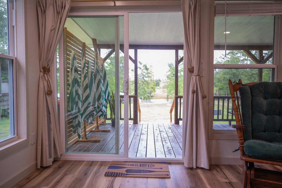 Relax in the living room with a bird's eye view of the lake!