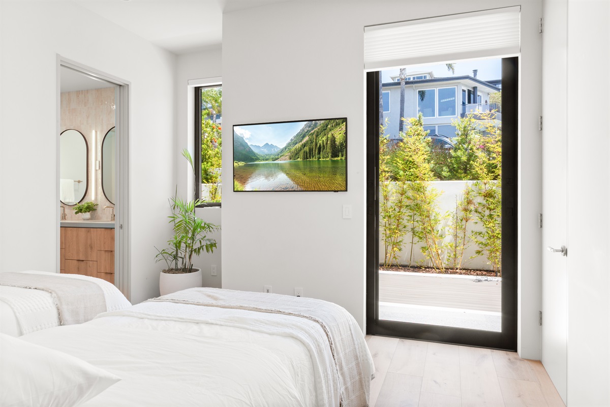 Guest bedroom 1 with Smart TV and ensuite bathroom - main floor