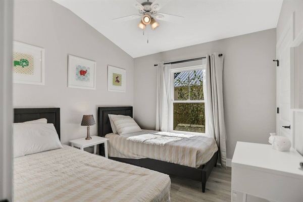 Bedroom 3 features two twin XL beds, ceiling fan, and a closet.  