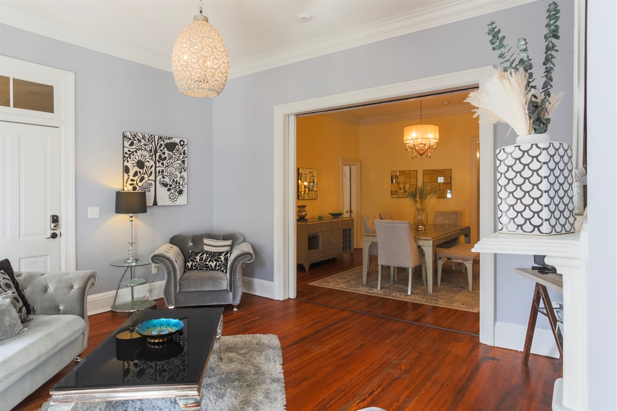 The living room flows seamlessly into the formal dining area, creating the perfect space for gathering and entertaining.