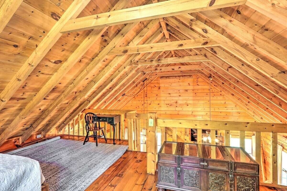 Loft with two twins and a desk.