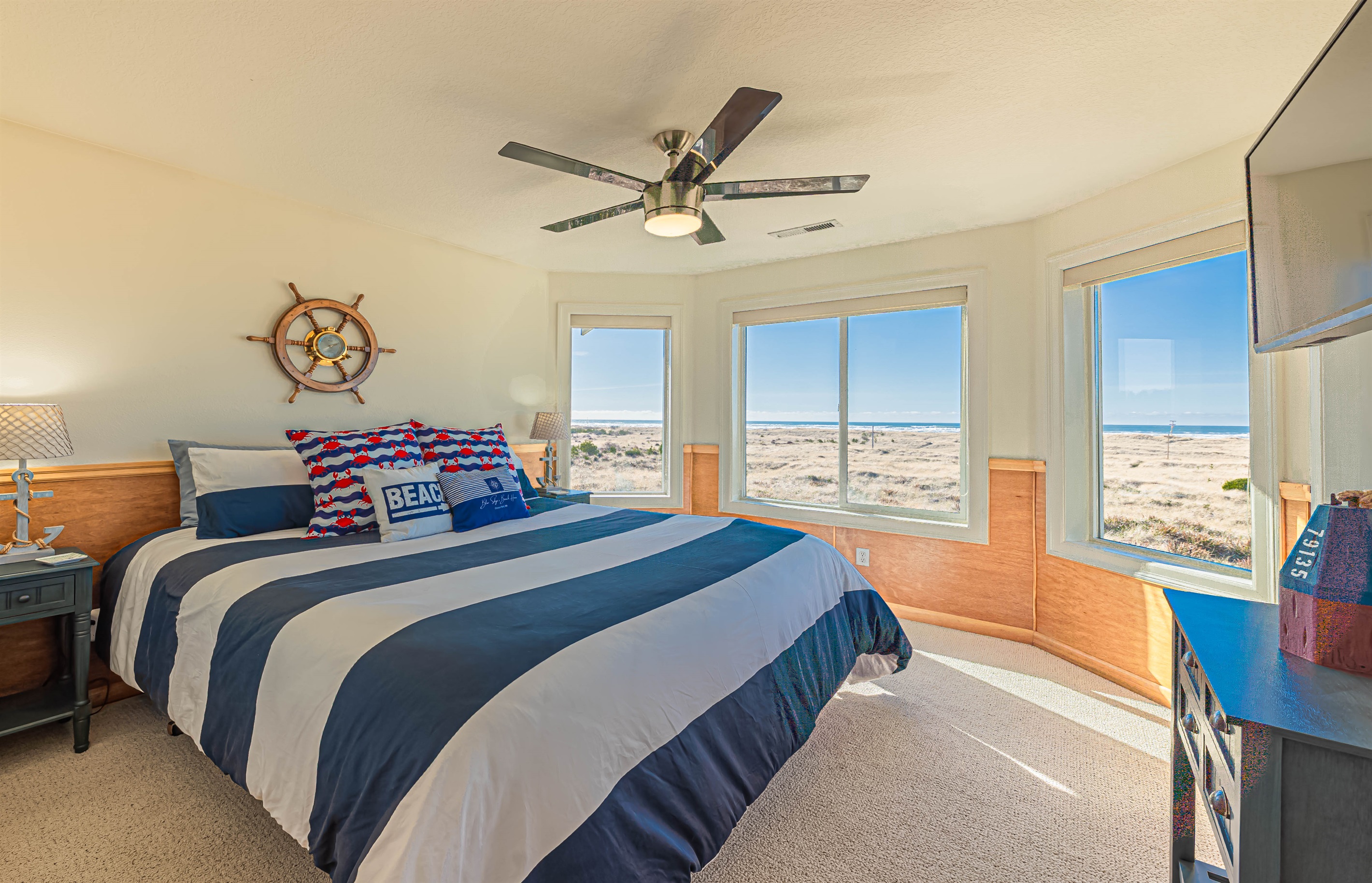 "Captain's Quarter's" bedroom boasts the best view in the house! This bedroom is complete with King size memory foam mattress, 180 degree ocean views & door leading to 3rd floor deck!