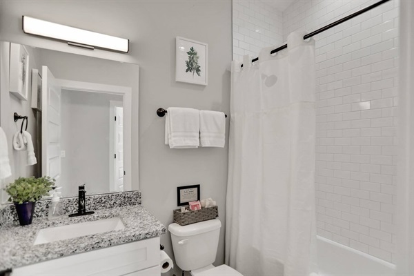 Tastefully decorated full bathroom located near the 2nd and 3rd bedroom.  We provide a starter set of toiletries for your visit.