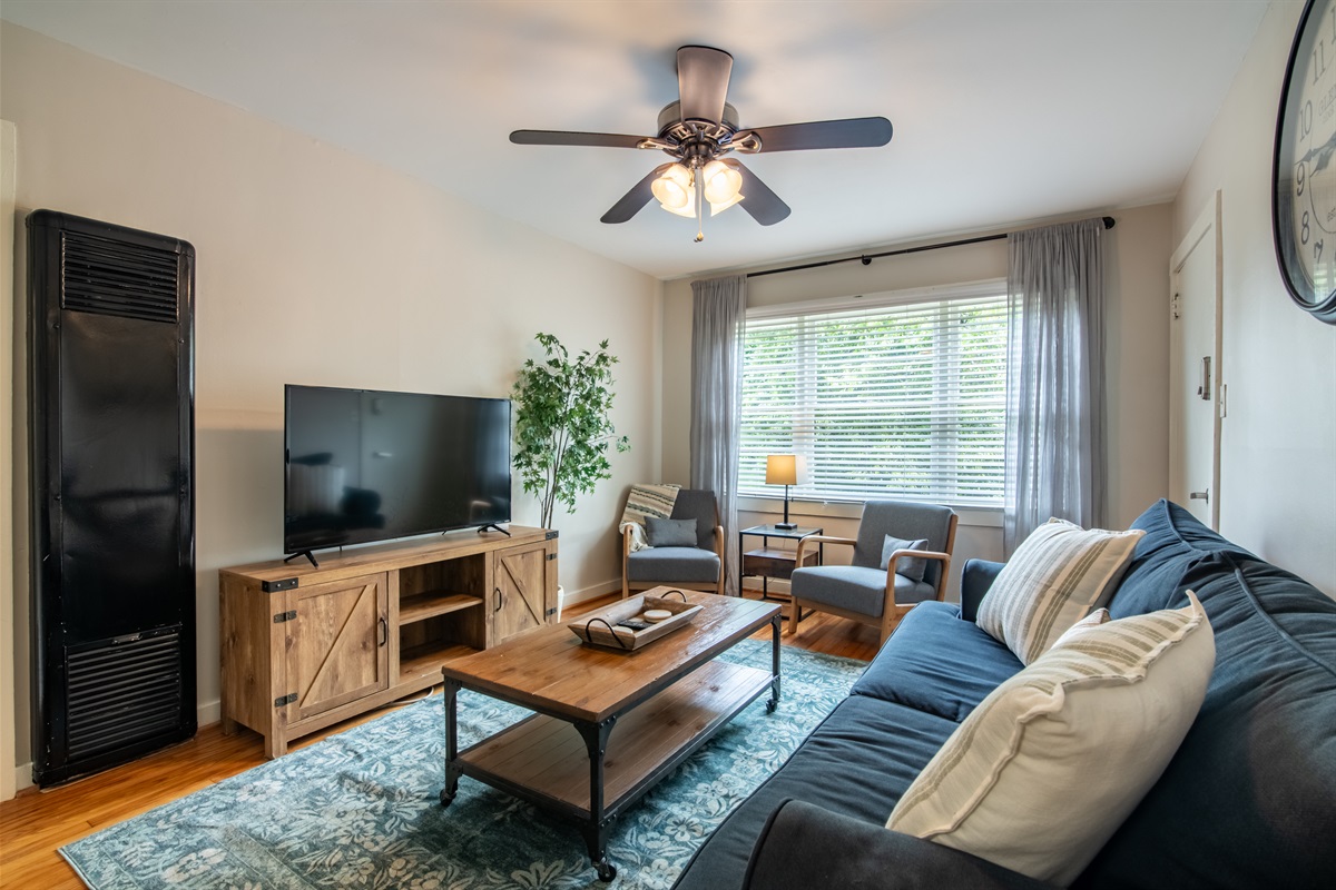 Comfort and charm come together in this bright living space with modern decor.