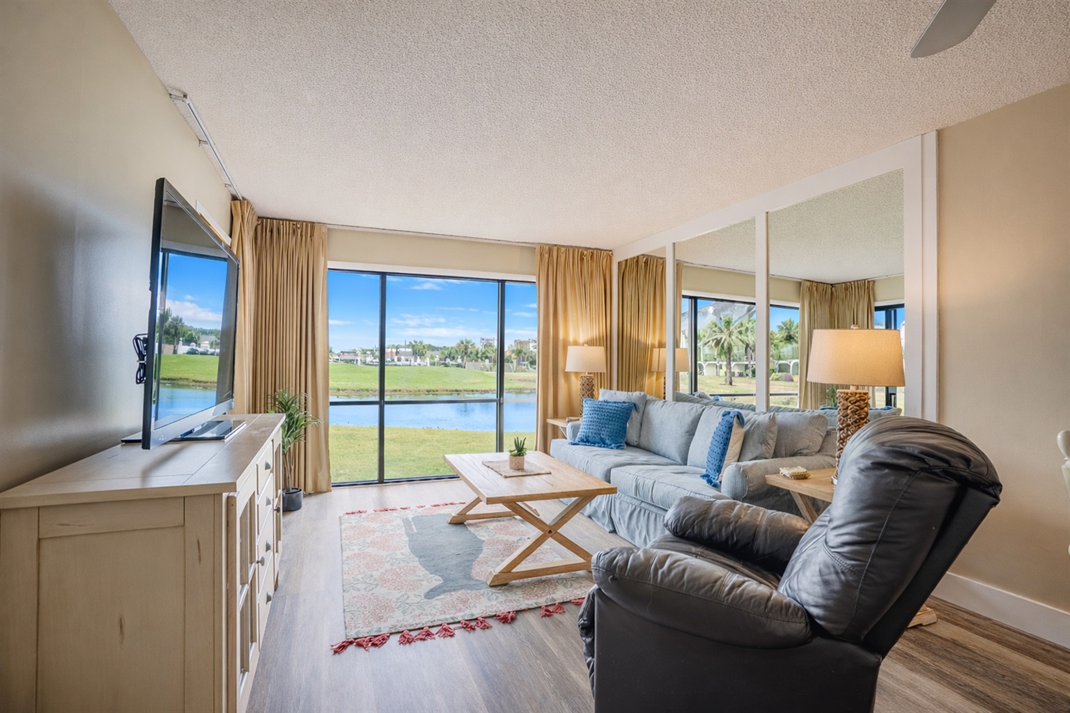 Living area with smart TV and golf course view