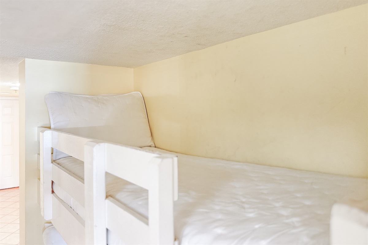 Perfect for the little ones or extra guests! This cozy hallway bunk area provides a fun and functional space for everyone in your group to get a good night's sleep.