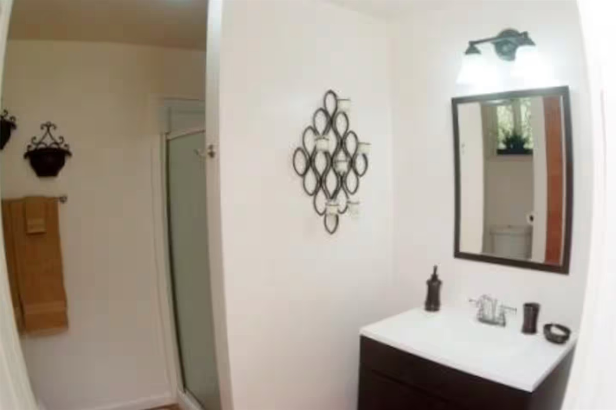 Full bathroom and shower( washer and dryer are located on the outside of the cottage)