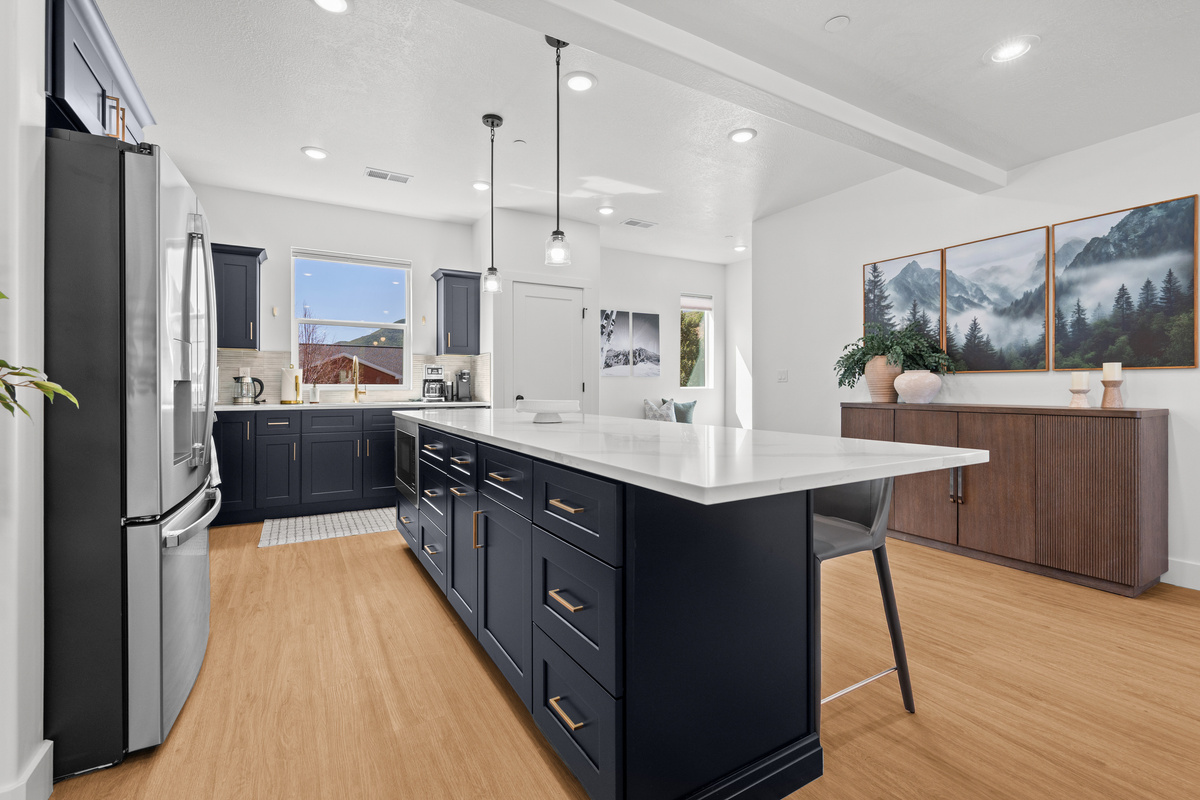 The spacious kitchen is designed for group stays, with abundant workspace and an inviting connection to the main living areas.