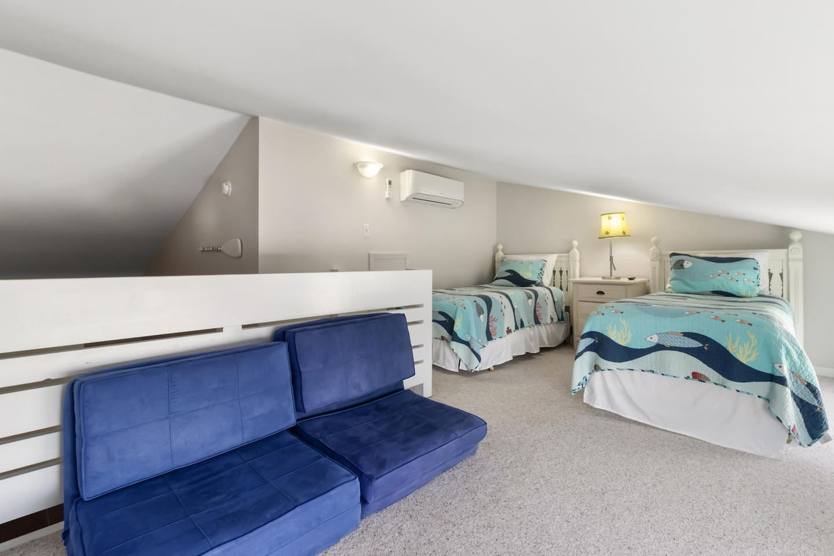 Sleep the kids up in the loft &mdash; two twin beds and a sitting nook that turns into their own little headquarters.