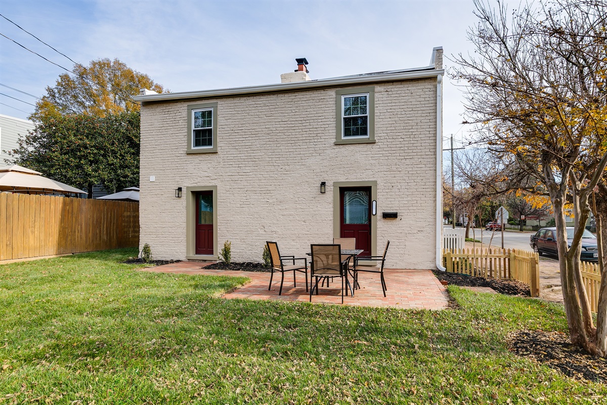 Charming Patio Retreat: Enjoy al fresco dining in your private brick patio oasis!