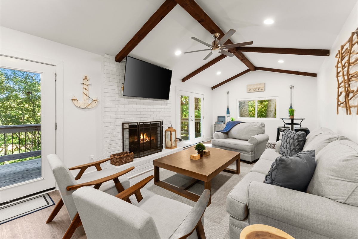 The living room is the perfect spot to cozy up and watch a movie or to relax with friends and family.