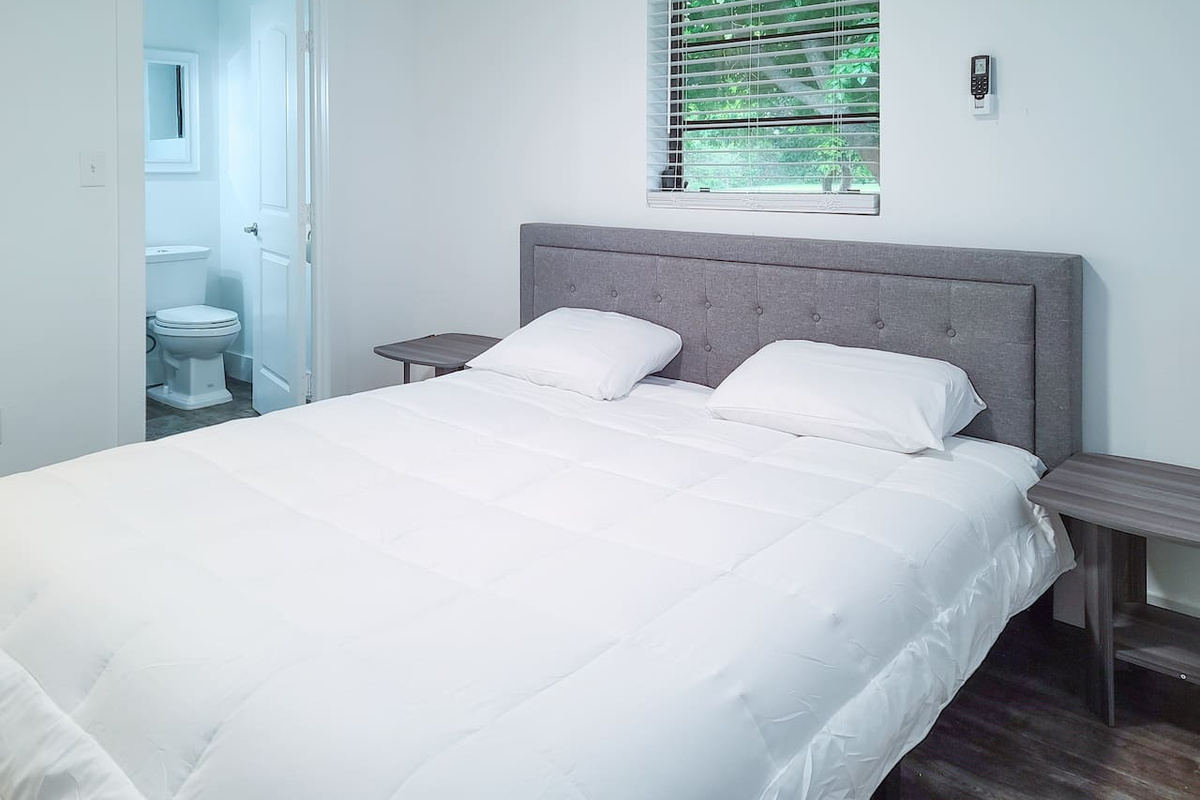 Bedroom 4: Separate King Bed Suite with private full bathroom. Access via the house or from separate entrance door