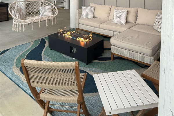 The patio area is made for relaxing with your family and friends, with a luxurious sofa with chaise lounge, a comfortable hammock swing, and a wonderful firepit for those cooler evenings.  You’ll want to spend all your time here!!