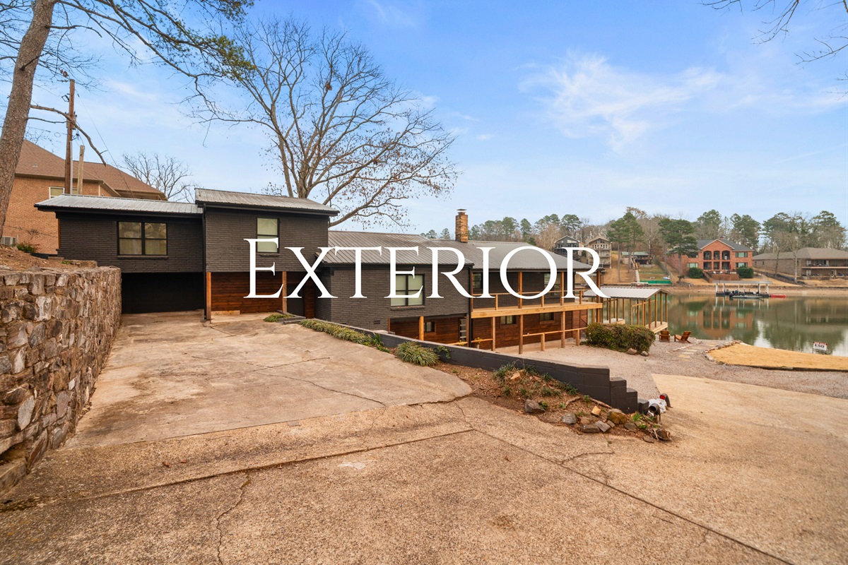 From this lakeside perspective, the home&rsquo;s beautiful waterfront location and easy access to the dock are on full display.