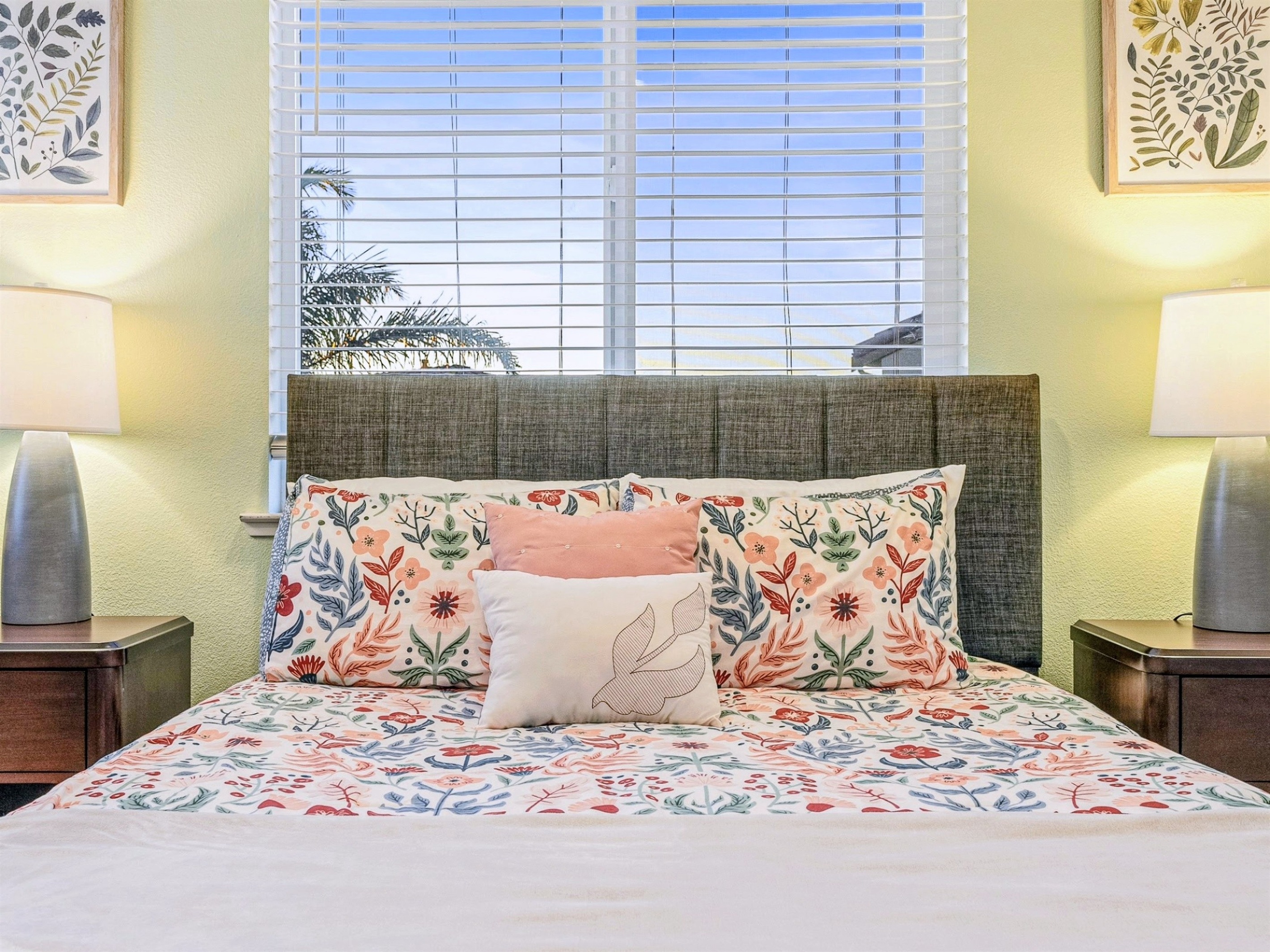 Comfortable bedroom with patterned bedding