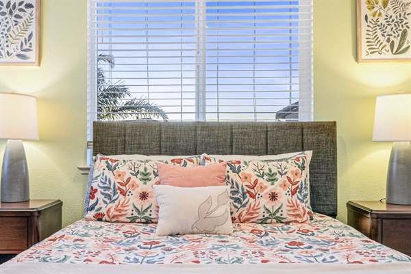 Comfortable bedroom with patterned bedding