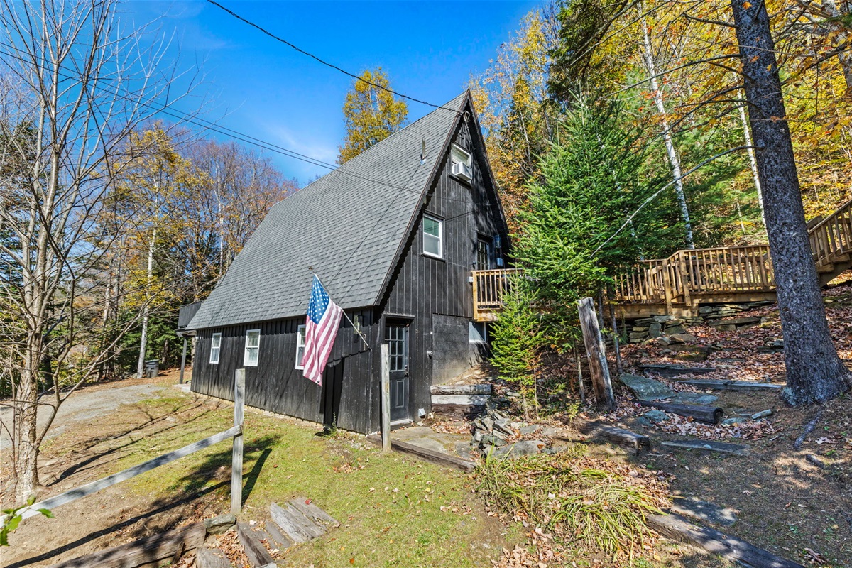 View the house with the bridge to the bunk house seen