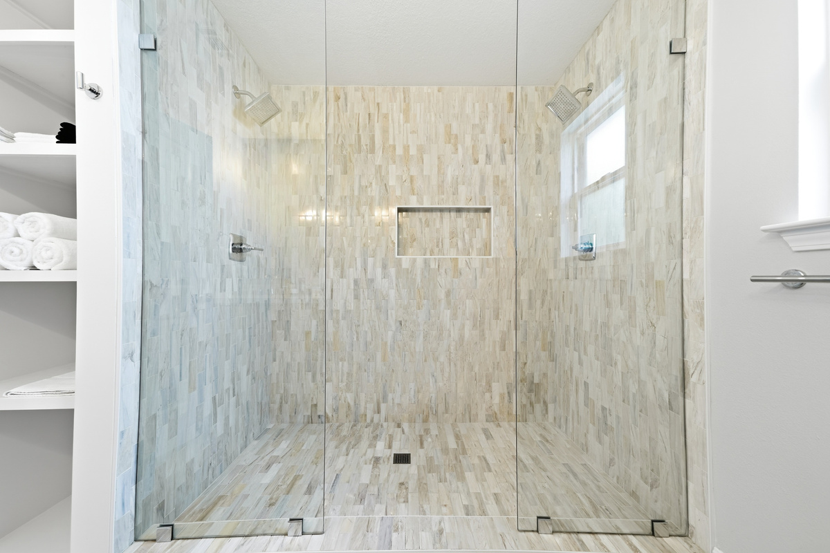 Spa like primary bath with double vanities and double shower