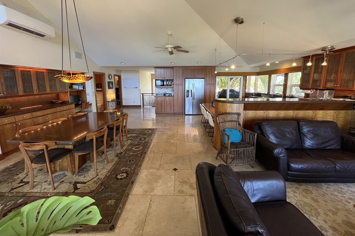 Living room, Dining room, & Kitchen, w/ travertine tile & high-pitched ceiling 