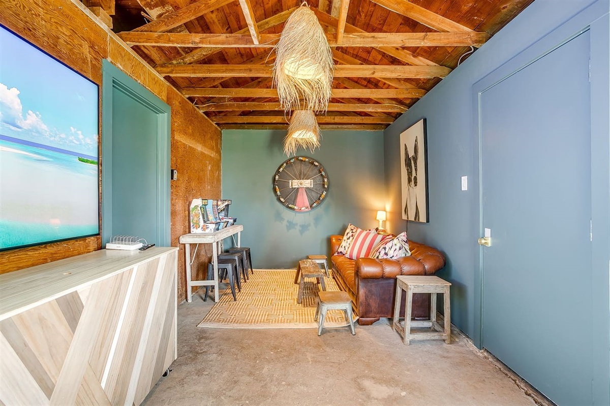 Outdoor game lounge integrated into the bar and seating area