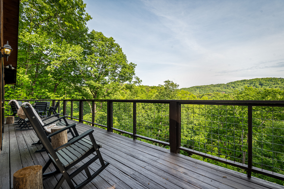 Relax in the rocking chairs on the main level deck.