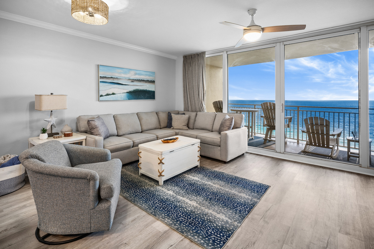 Relax in the bright and breezy living room with floor-to-ceiling Gulf views. Comfy seating, coastal decor, and direct balcony access make it the perfect place to unwind after a day in the sun.