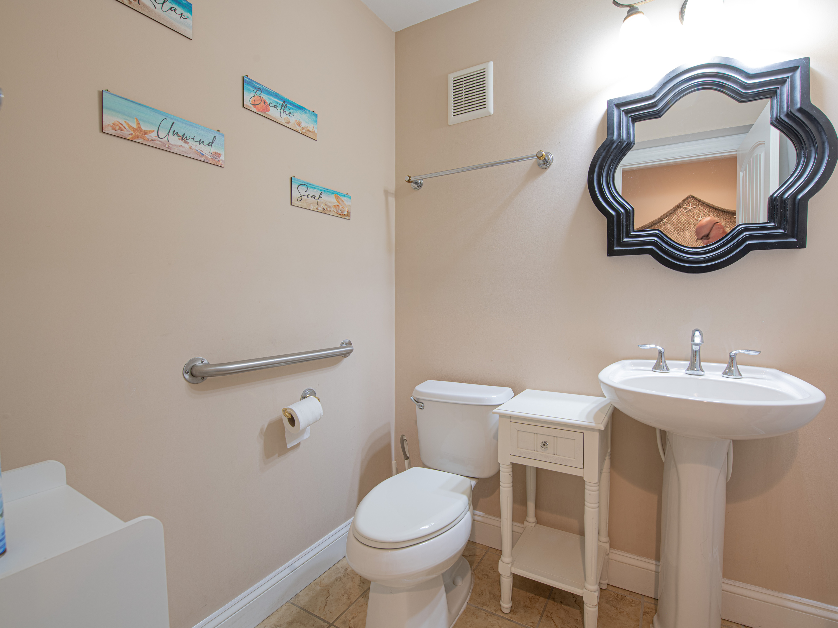 Half Bathroom with Pedestal Sink, Decorative Mirror