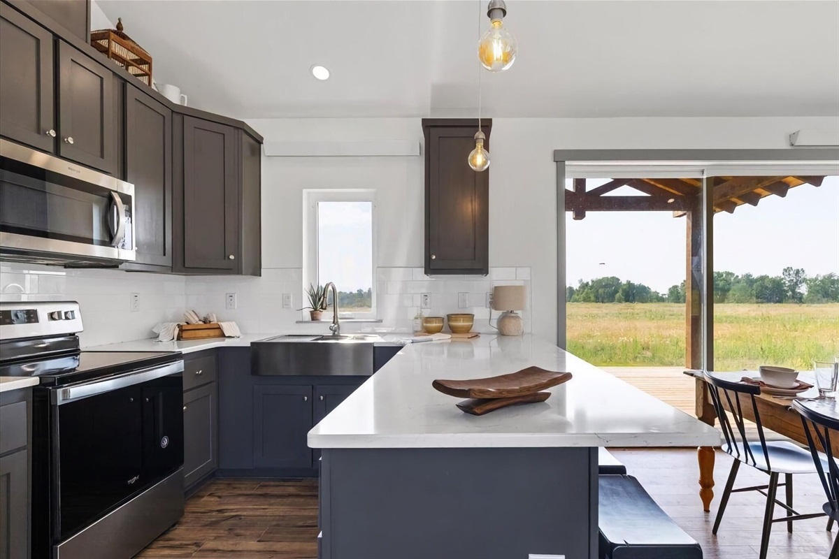 The kitchen is fully stocked and equipped with appliances and kitchen gadgets — it is a breeze preparing any meal.