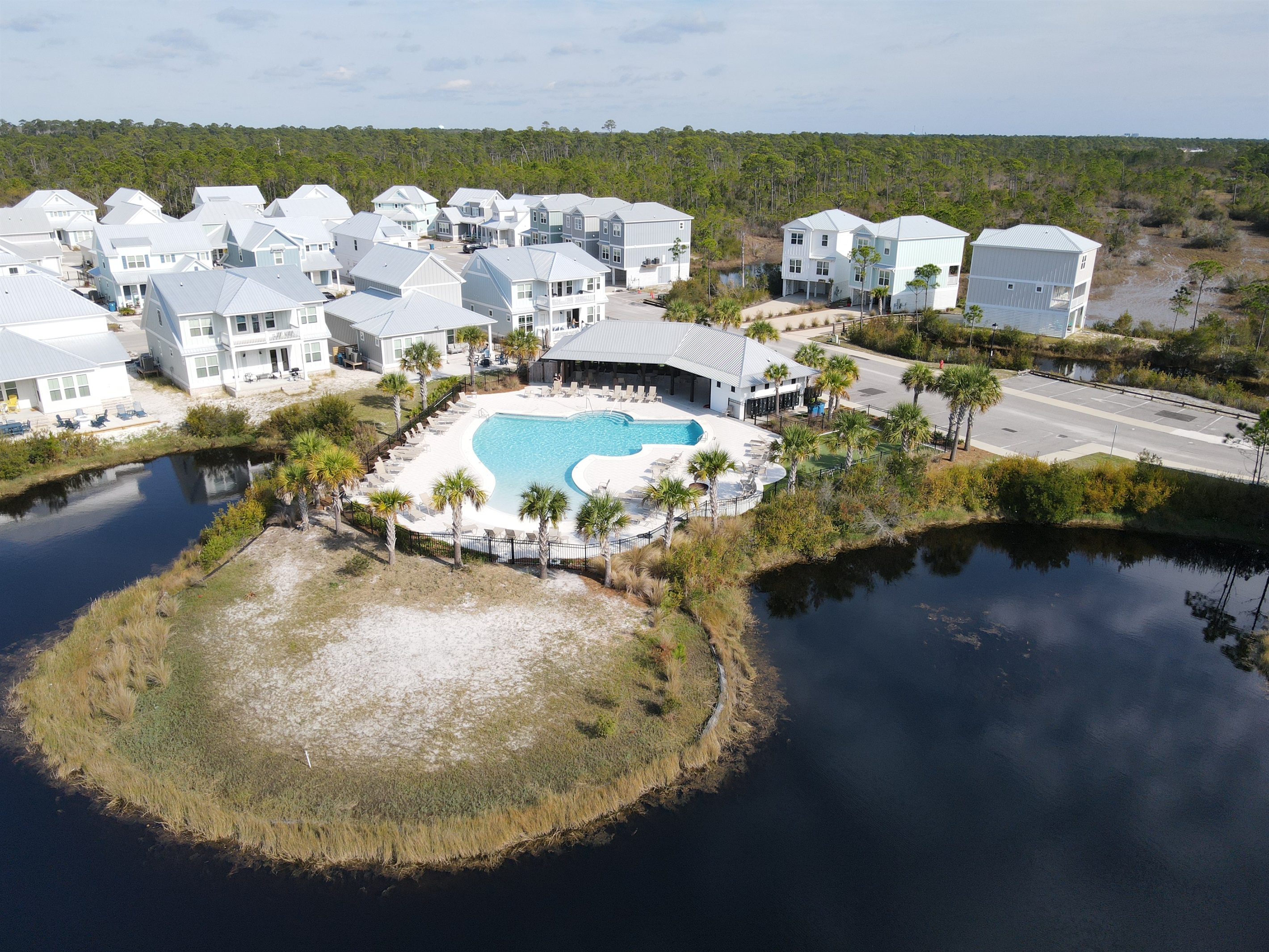 The beautiful zero entry pool, centrally located in the Summer Salt community with views of the wetlands.
