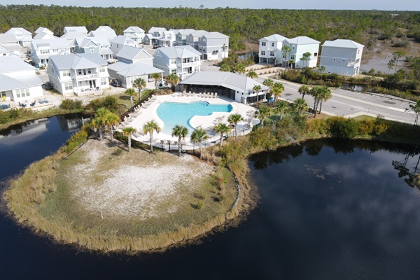 The beautiful zero entry pool, centrally located in the Summer Salt community with views of the wetlands.