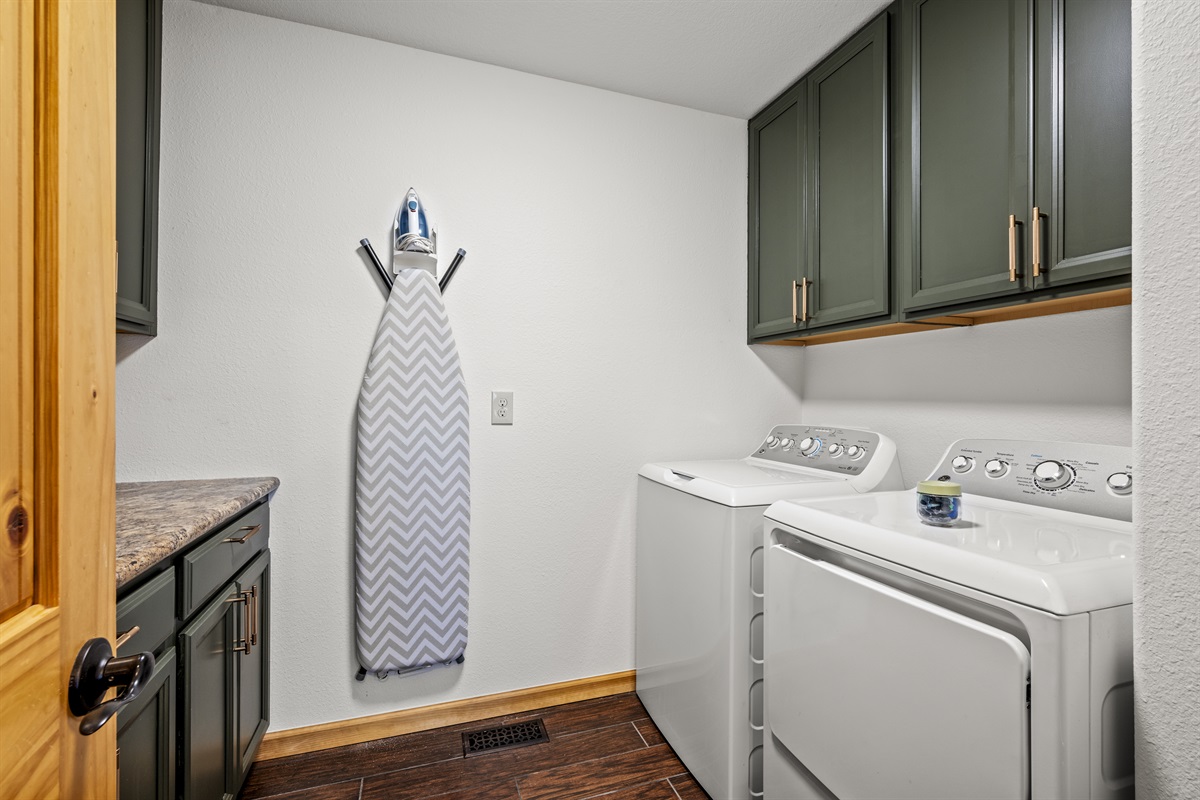 Make your stay more convenient with the ample laundry room at Signature Stay, offering plenty of space for all your needs