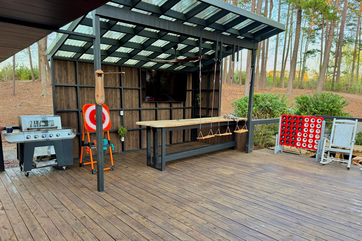 12 foot long bar with 75 inch TV, grill and games!