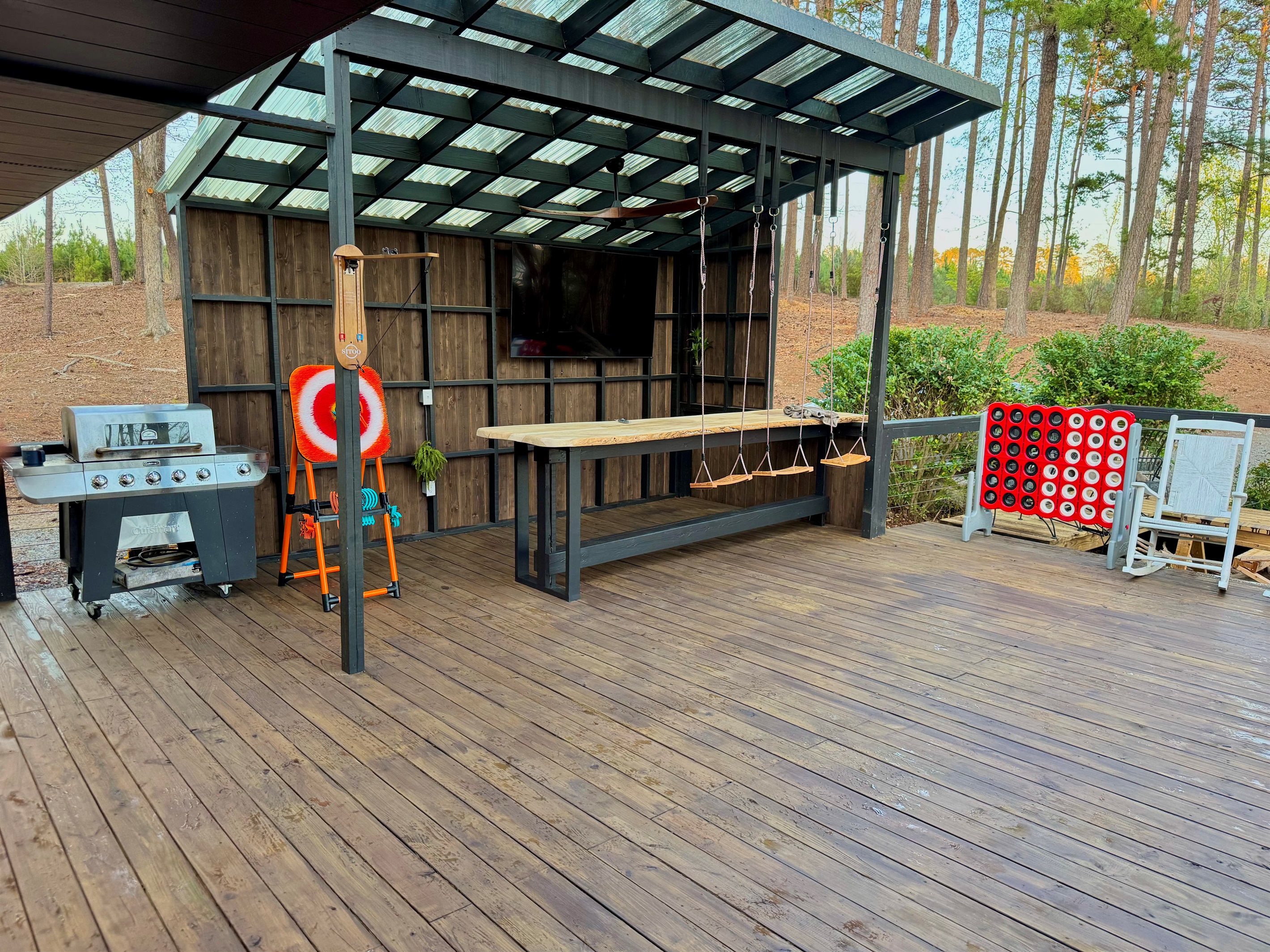 12 foot long bar with 75 inch TV, grill and games!