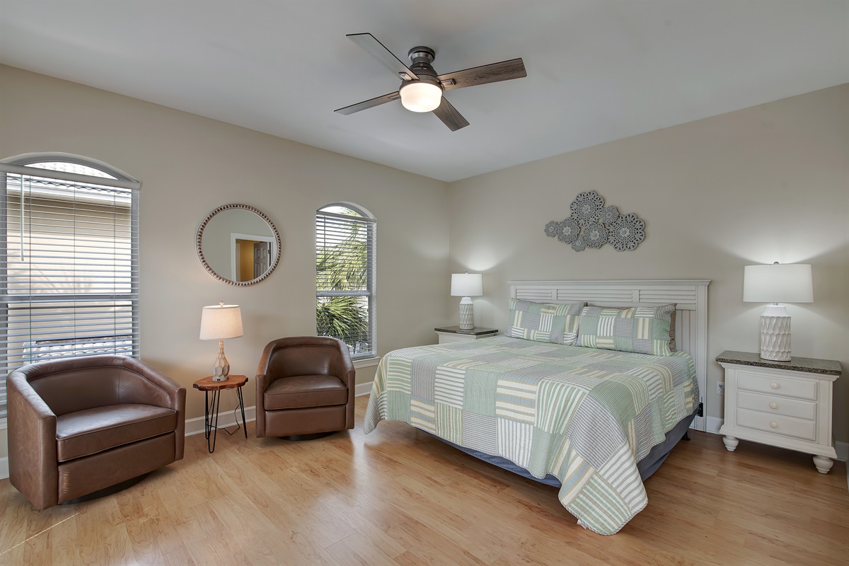 King bedroom with ensuite bath and balcony doors