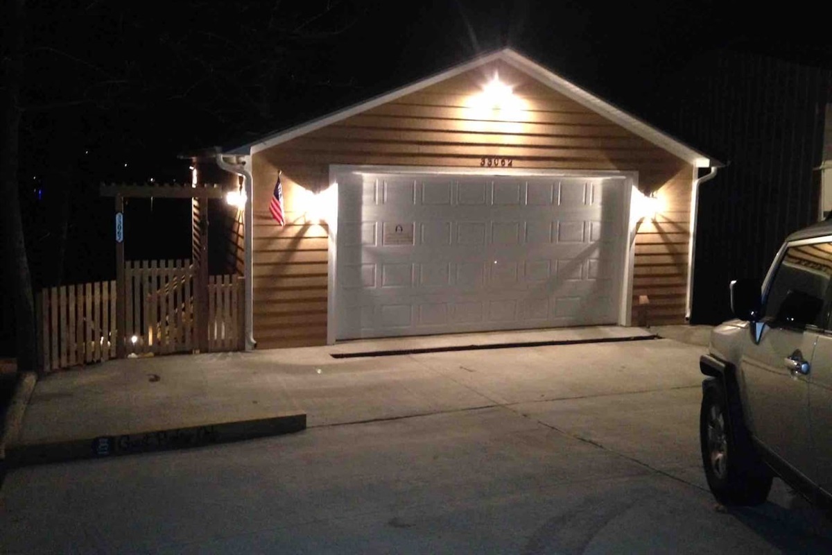 Well lit concrete driveway with reserved parking space for you. 