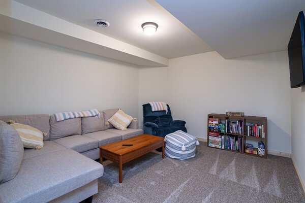 A place for the older kids to be kids and hang out with cousins. The TV room is located in the lower level.