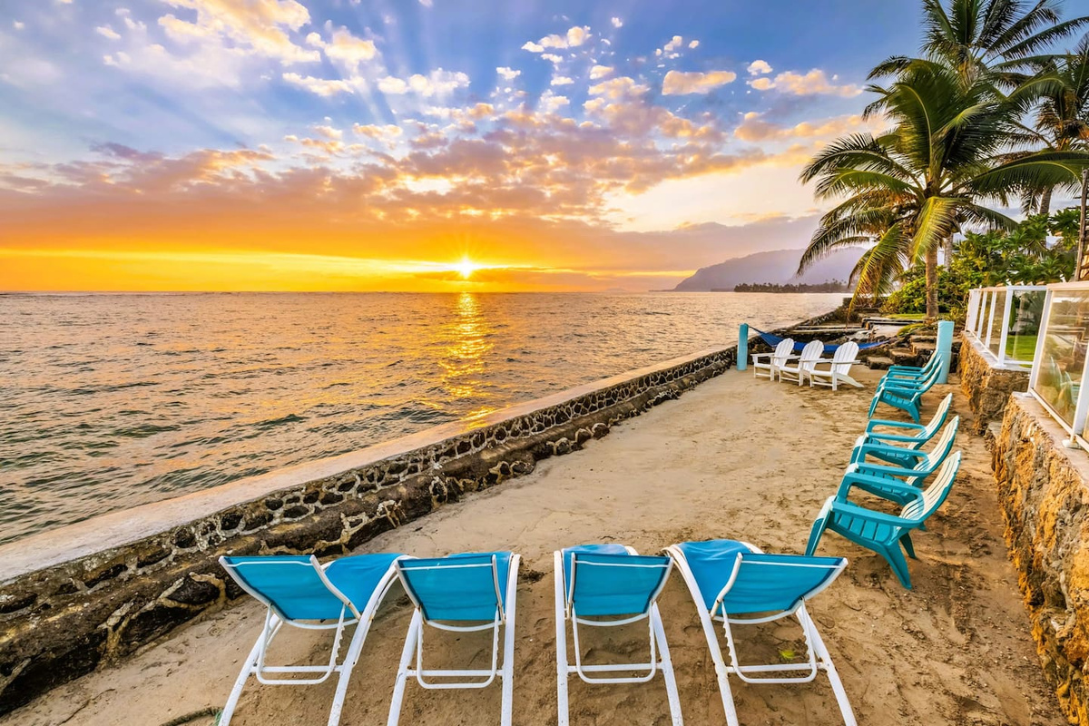Spectacular sunrise view from home's private beach at high tide