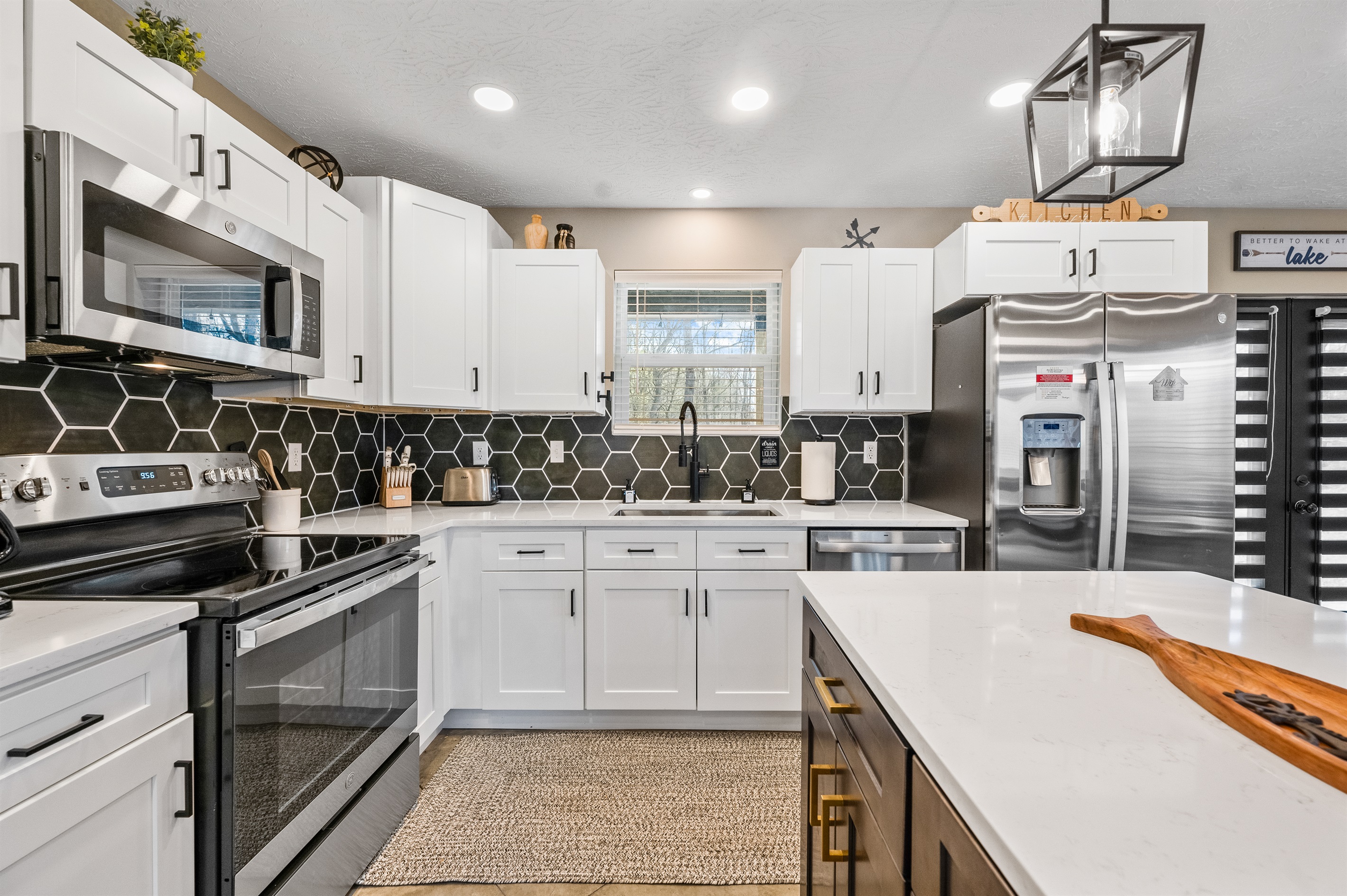 The kitchen and dining area feature new appliances and all the essentials you need to cook, serve, and enjoy meals with family and friends.  A small selection of spices is provided in the cabinet next to the microwave.