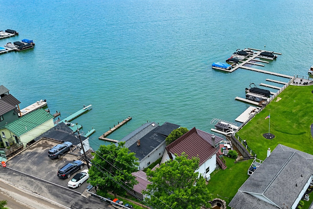 Centrally located with lake access, beautiful green space, and a quiet road behind—ideal vacation retreat!