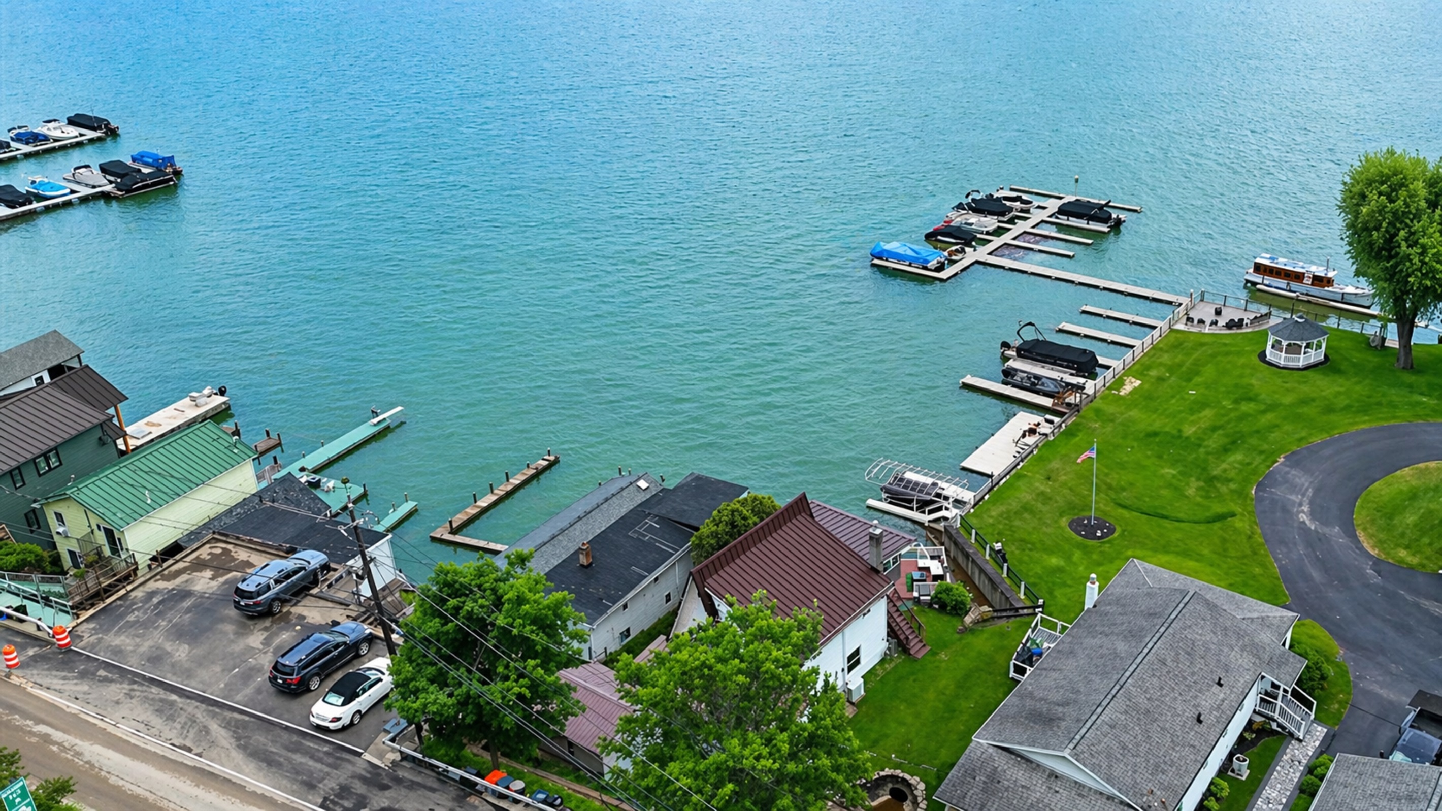 Centrally located with lake access, beautiful green space, and a quiet road behind—ideal vacation retreat!