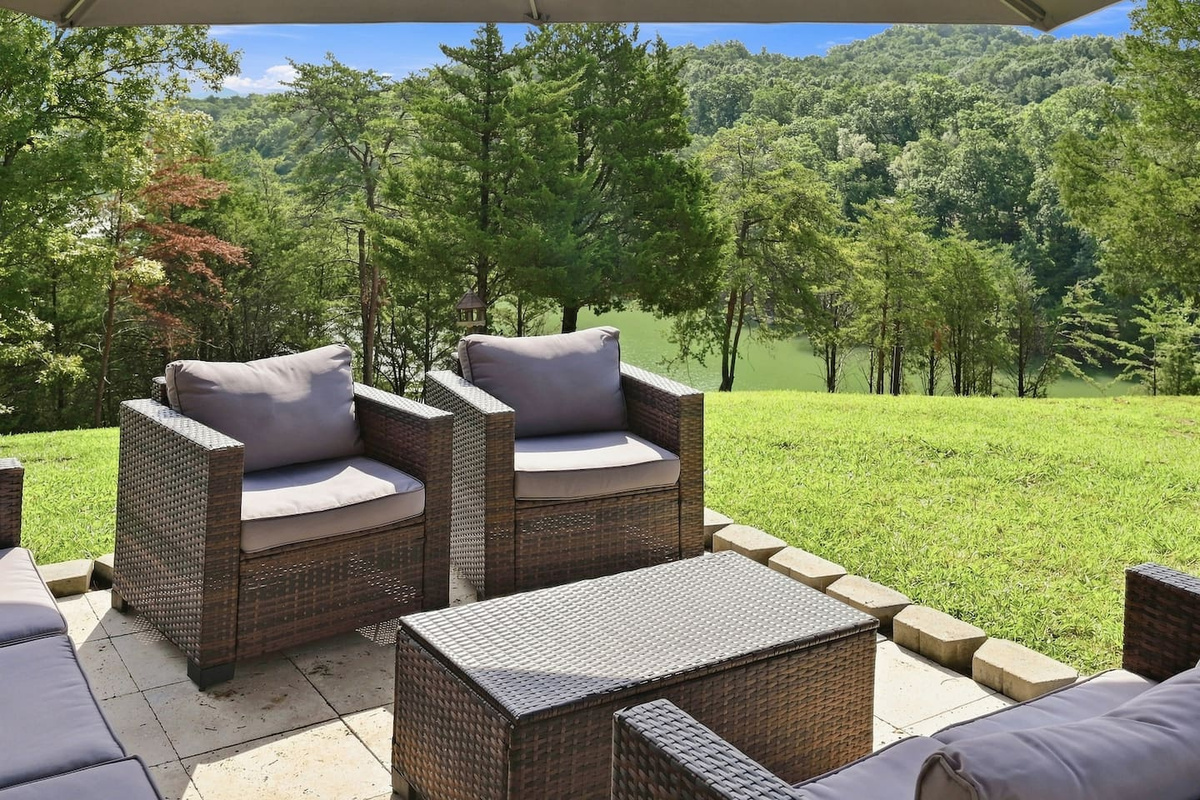 Kick back in the shaded backyard lounge with lake and distant mountain views. 
