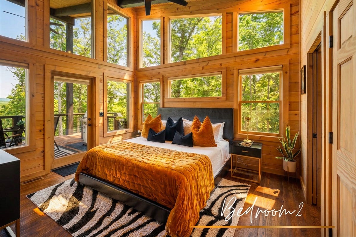 The second bedroom offers all the same luxuries as the primary suite. Style and sunbeams in every corner.