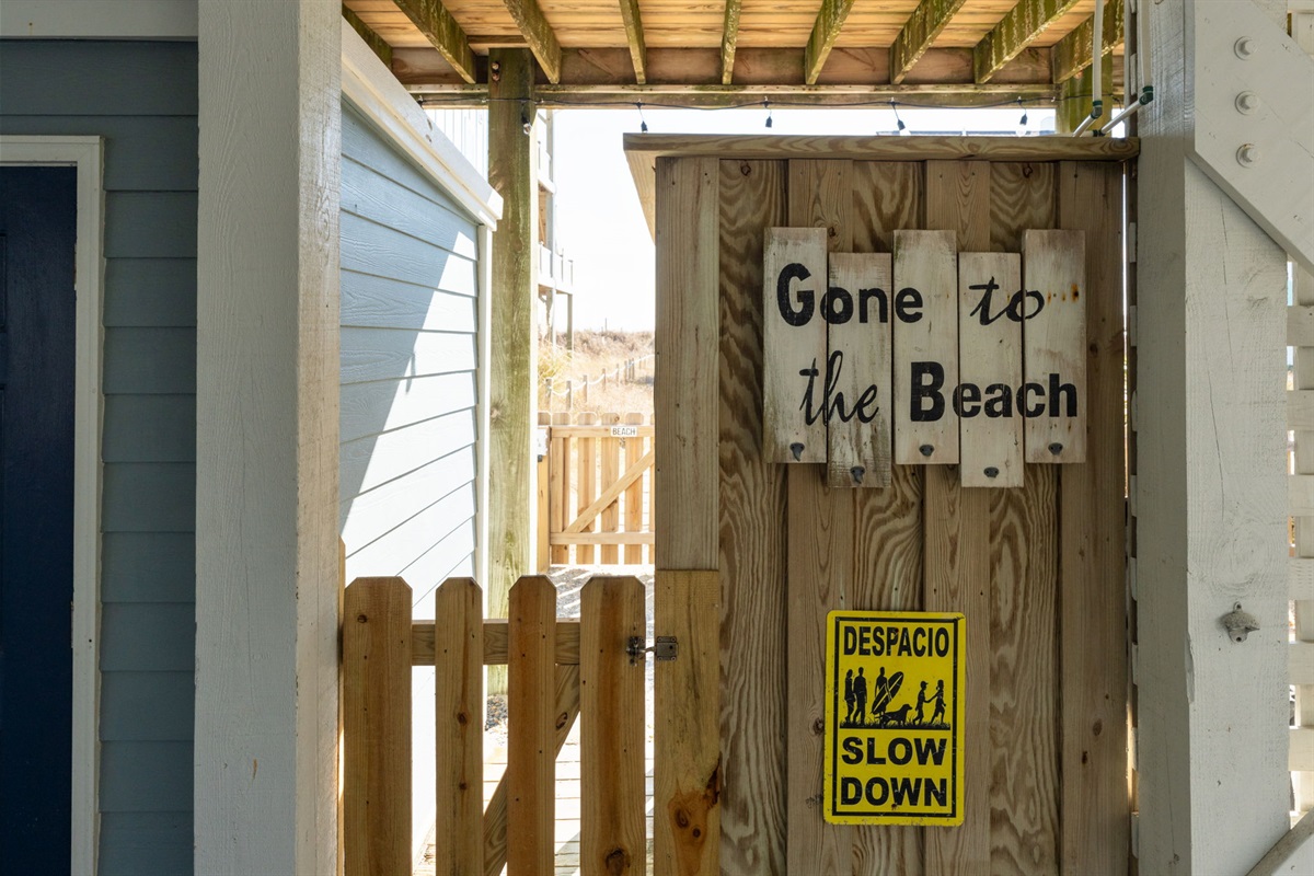 Access to the small fenced in area from the carport
