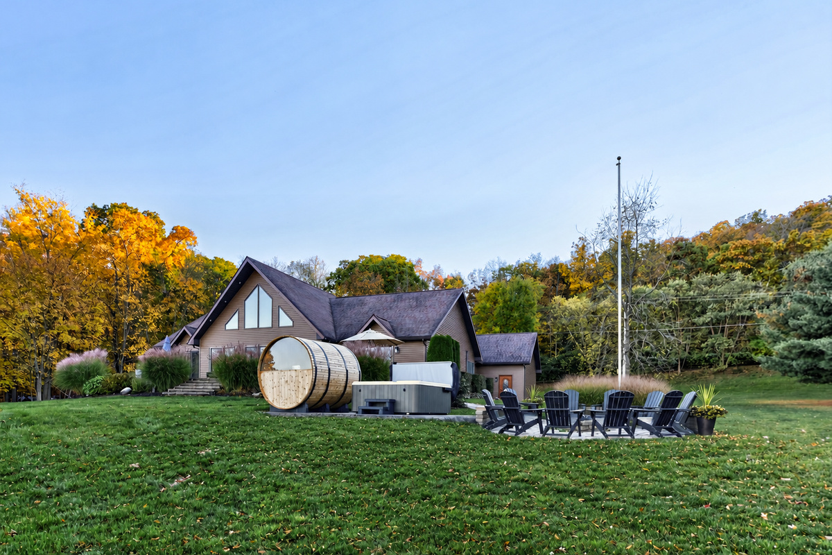 Expansive backyard with outdoor seating and sauna