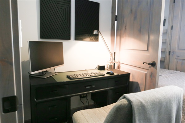 Remote workspace with docking station, keyboard, mouse, and monitor