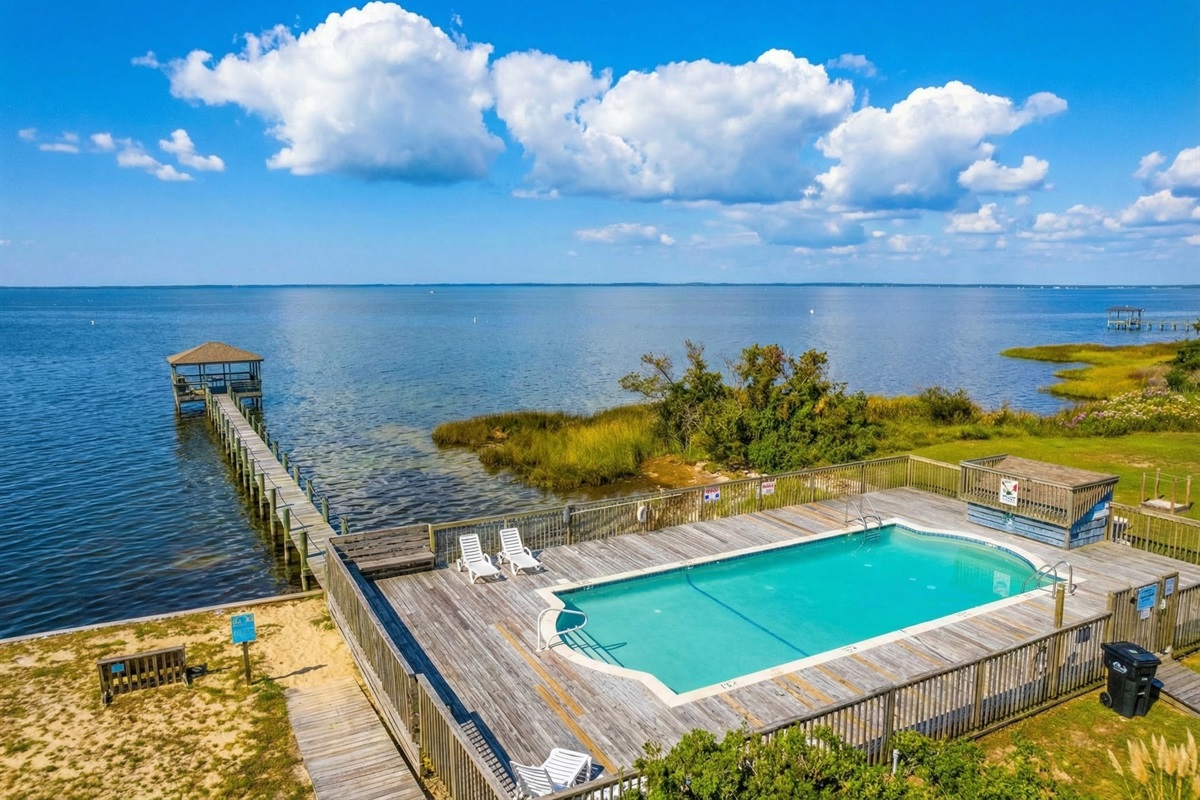 An aerial drone shot highlighting Southside Pearl's location, showing the short walk to the beach access.
