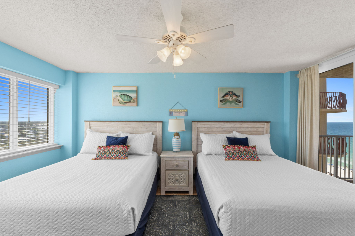 Bedroom 3 with two queen beds and a small private balcony