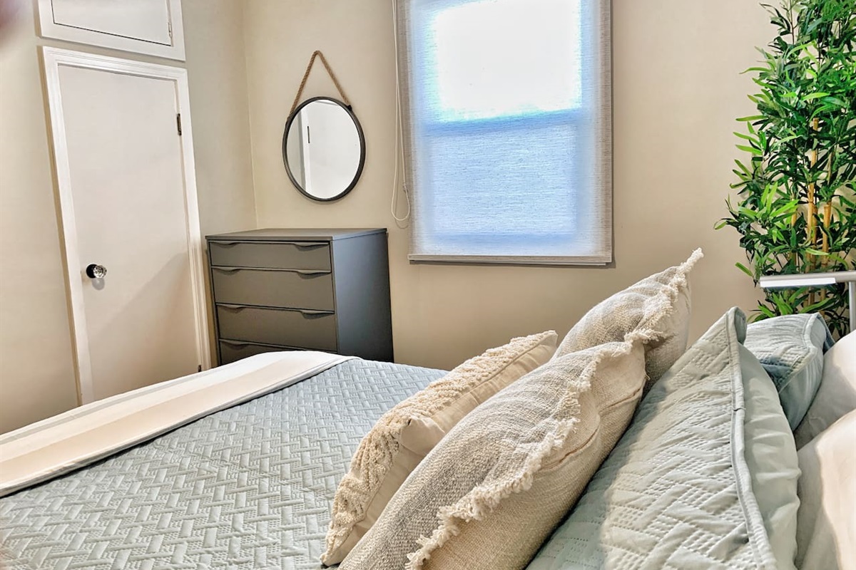 Cozy Second Bedroom with Comfortable Bedding & Warm, Neutral Décor
